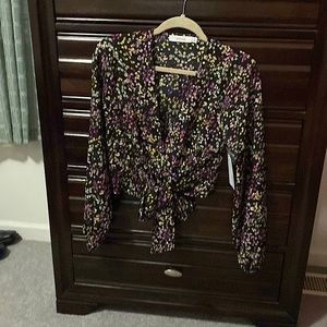 New black long sleeve crop top with white, lavender, rose, and yellow flowers